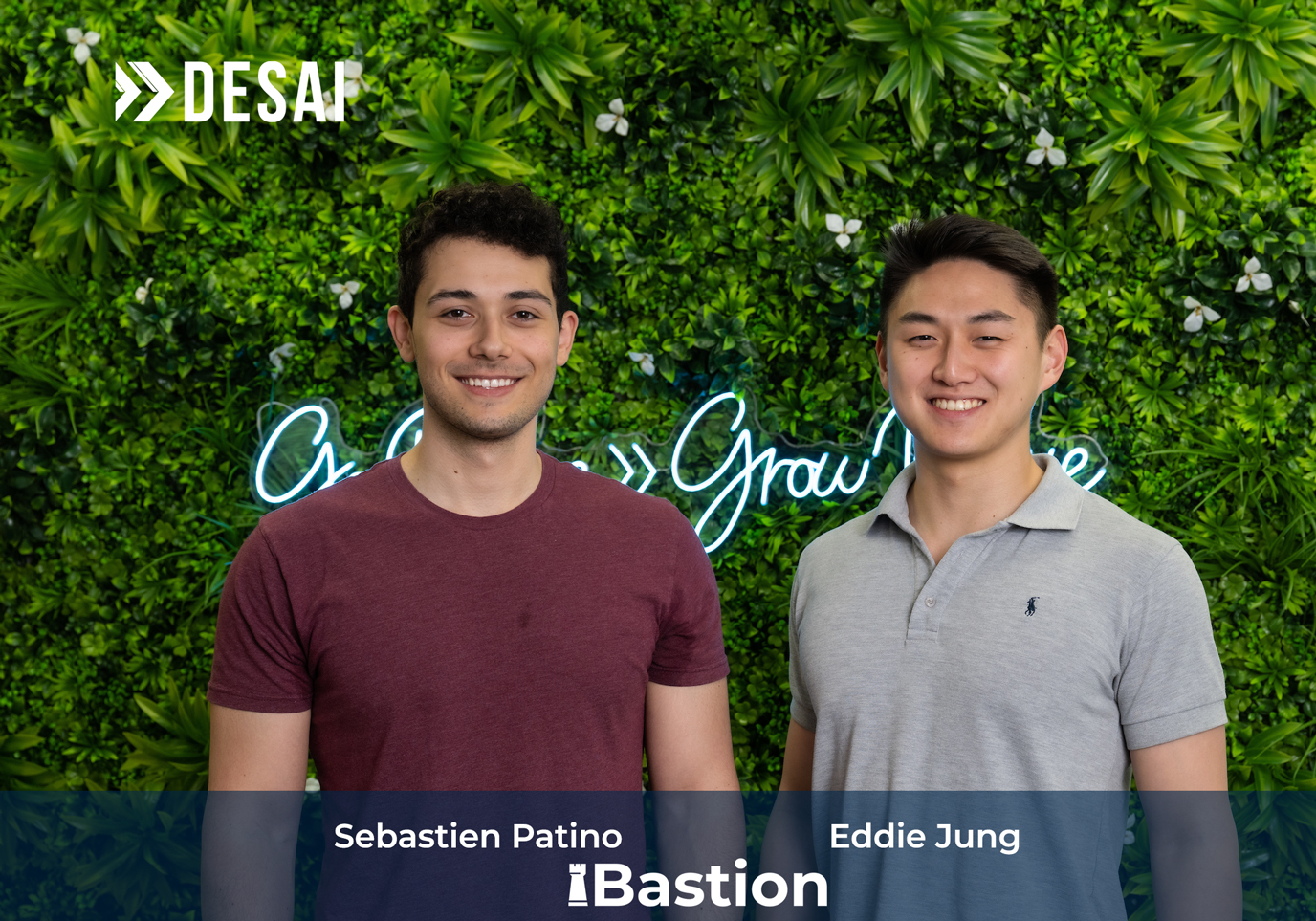Founders of Bastion standing against a wall of greenery.